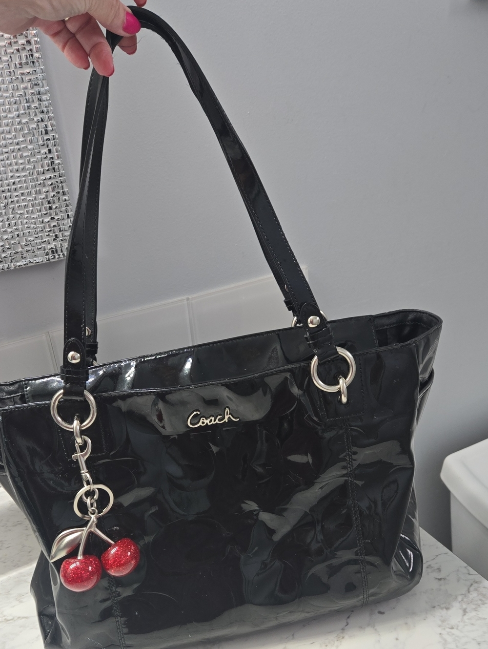 Coach Patent Leather Purse In Black Liquid Gloss Comes with Red Cherry Charm.
